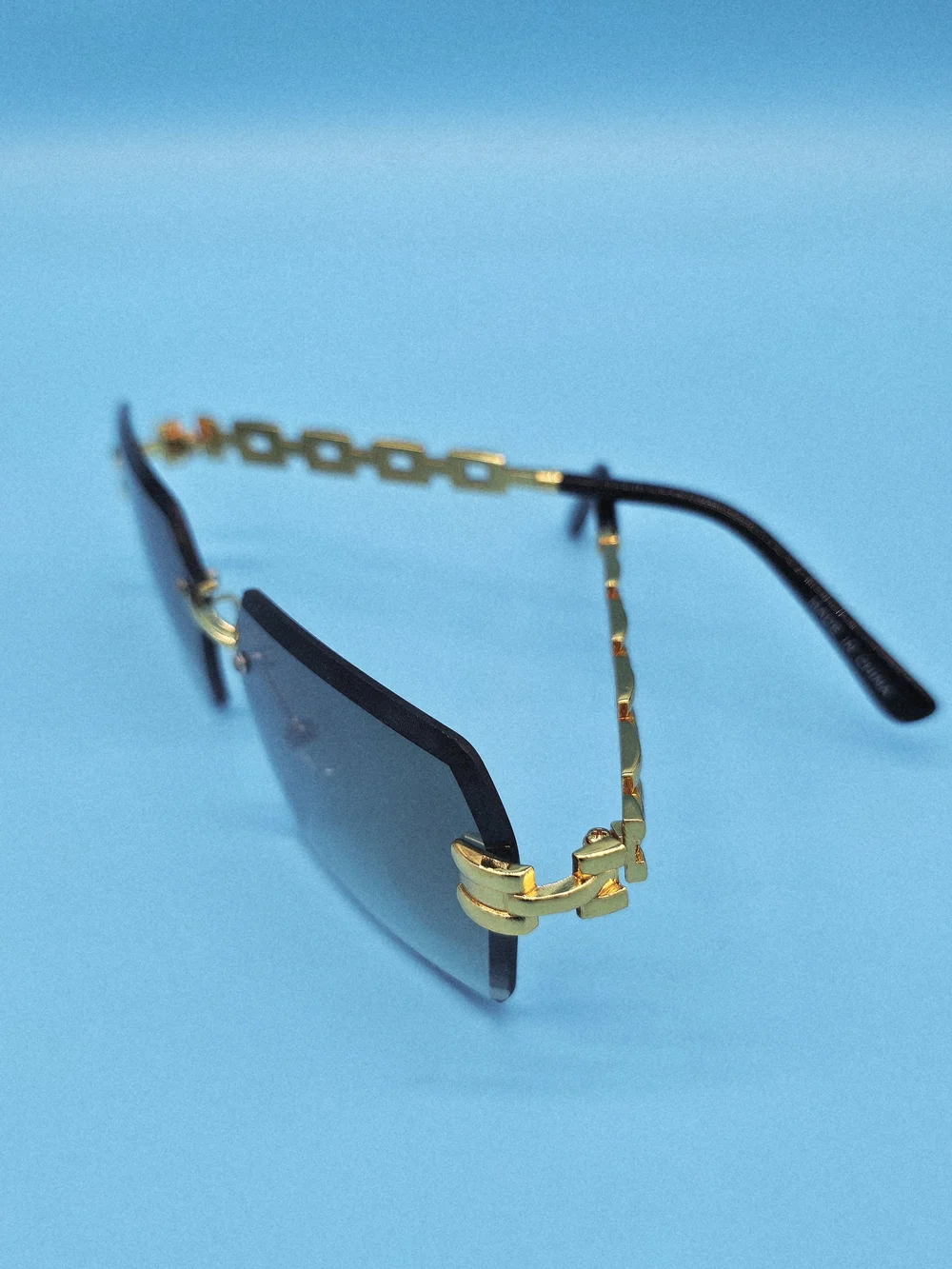 Gold-Accented Rimless Gray Sunglasses - Unisex Accessories